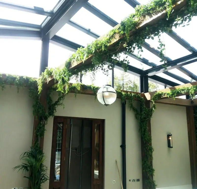 Artificial vines foliated and applied to interior beams in a hotel