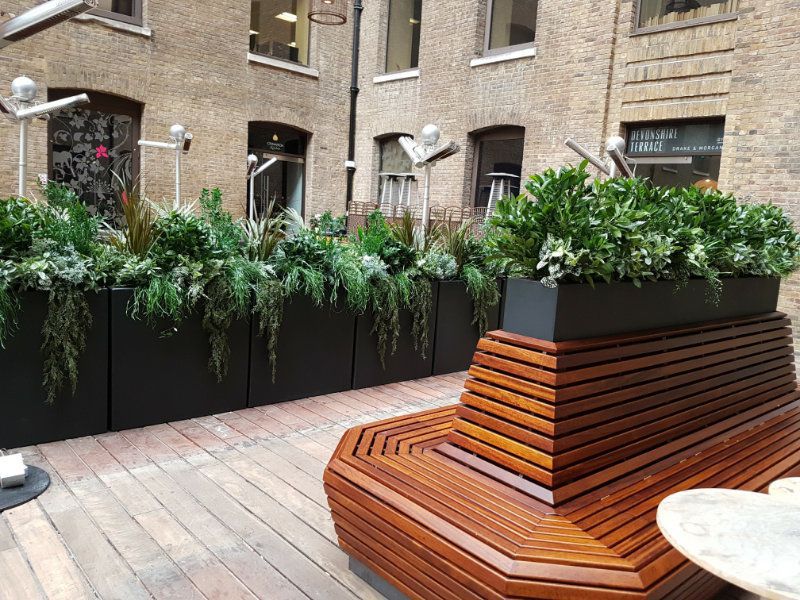 Outdoor artificial trough planting for restaurant