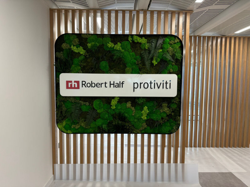 Moss art with preserved foliage and illuminated logo Workplace Creations Robert Half
